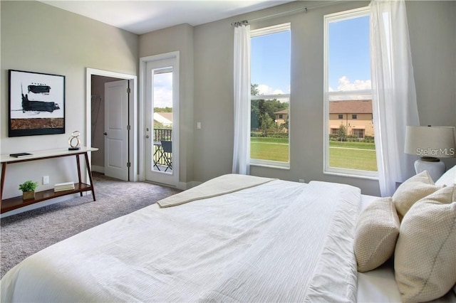 carpeted bedroom featuring access to exterior