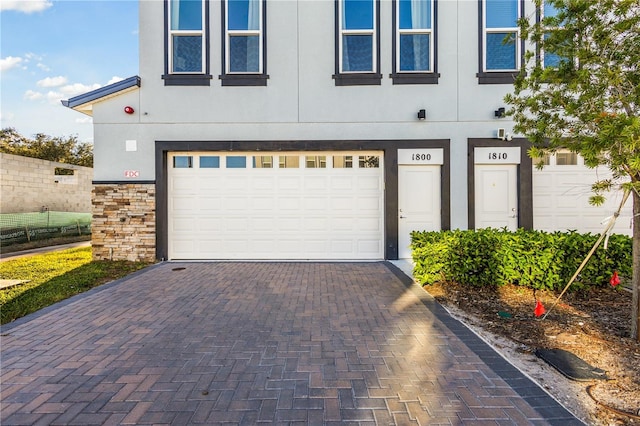 1800 Houston St, Kissimmee, FL 34743 - garage featuring decorative driveway