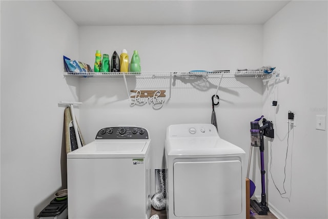 clothes washing area featuring washing machine and dryer