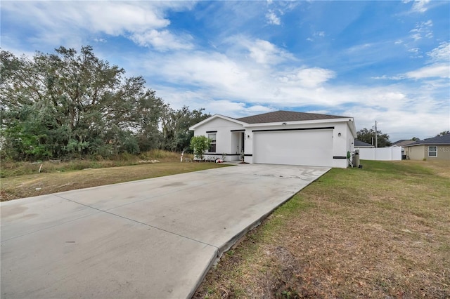 view of front of home with a garage and a front yard