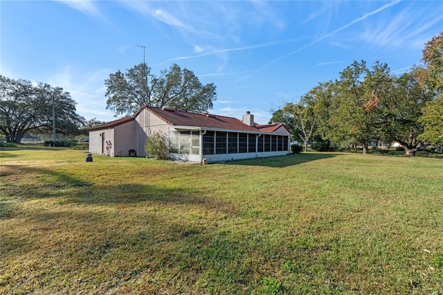 view of yard featuring a sunroom