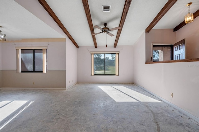 empty room with ceiling fan, beam ceiling, and a textured ceiling