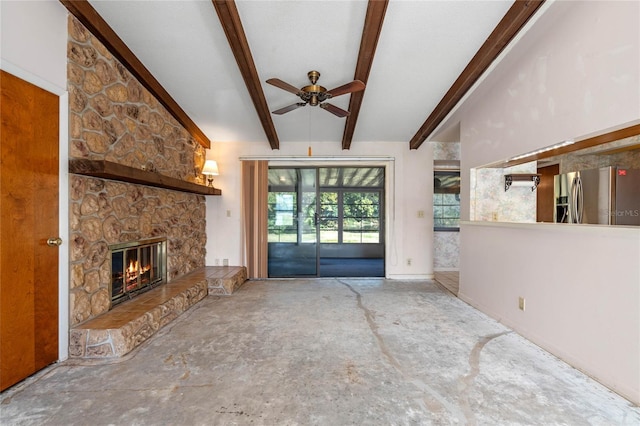 unfurnished living room with beamed ceiling, ceiling fan, and a fireplace