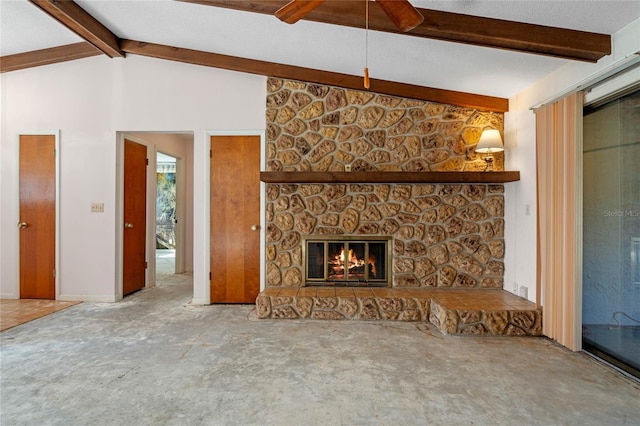 unfurnished living room featuring vaulted ceiling with beams, ceiling fan, and a fireplace