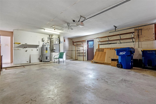 garage with electric water heater and a garage door opener