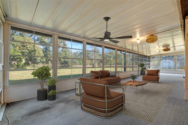 sunroom featuring plenty of natural light and ceiling fan