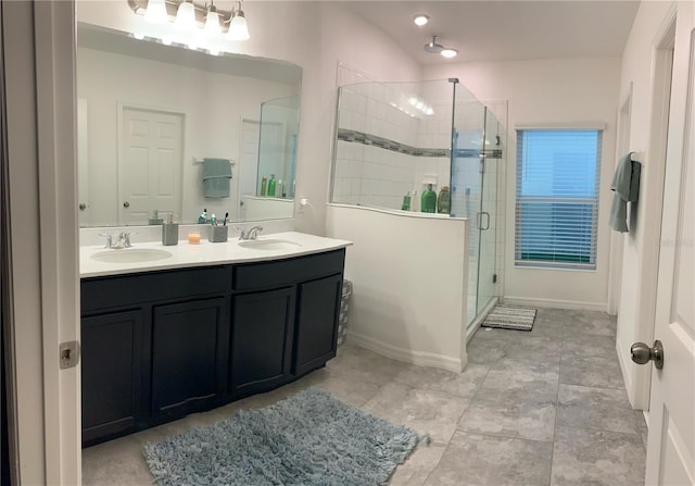 bathroom featuring vanity and an enclosed shower