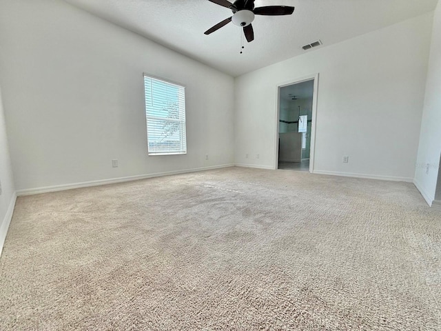 unfurnished room featuring light colored carpet and ceiling fan