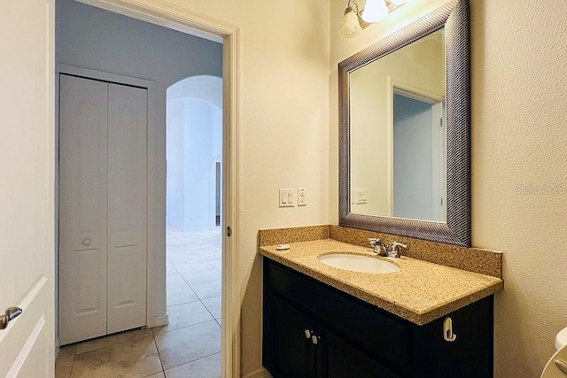 bathroom with tile patterned floors and vanity