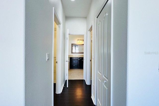 hallway with dark wood-style flooring