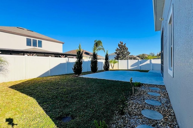 view of yard featuring a fenced backyard and a patio