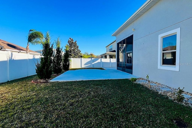 view of yard with a patio and a fenced backyard