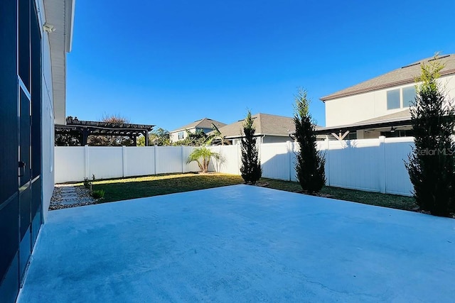 view of patio / terrace with a pergola and a fenced backyard