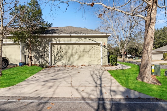 view of property exterior featuring a garage and a yard