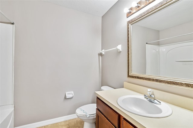 full bathroom featuring vanity, bathtub / shower combination, tile patterned floors, and toilet