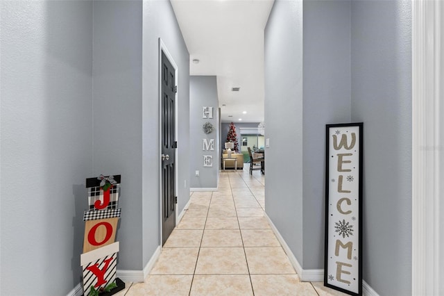 corridor featuring light tile patterned floors