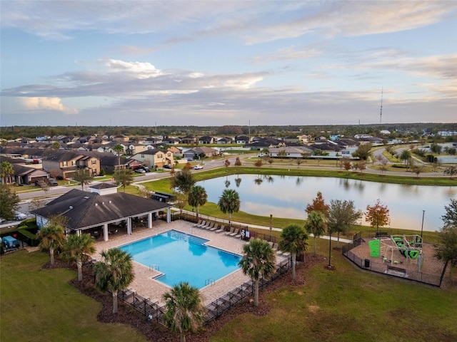 view of pool featuring a water view