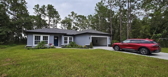 view of front facade with a garage and a front lawn