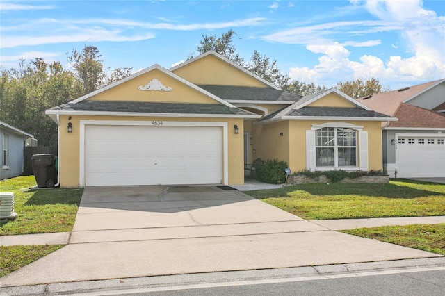 single story home with a front lawn and a garage