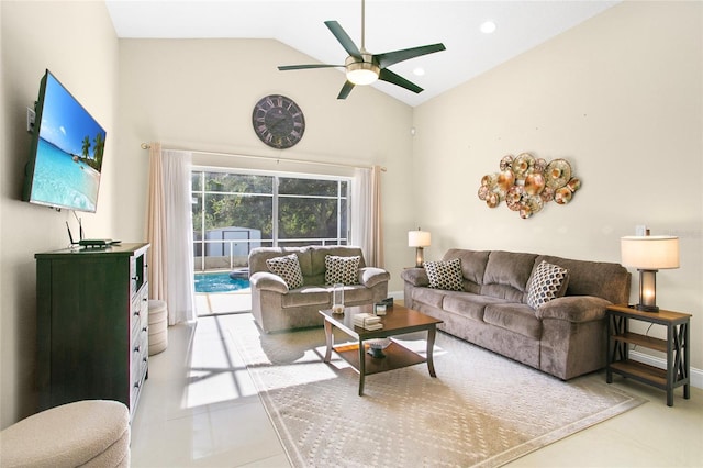 tiled living room featuring ceiling fan and high vaulted ceiling