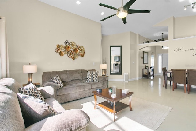 living room featuring ceiling fan and light tile patterned floors