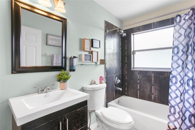 full bathroom with shower / bath combo with shower curtain, vanity, and toilet