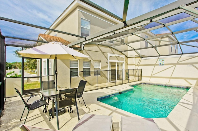 view of pool featuring a lanai and a patio