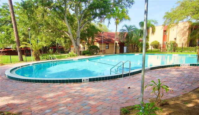 view of pool featuring a patio area