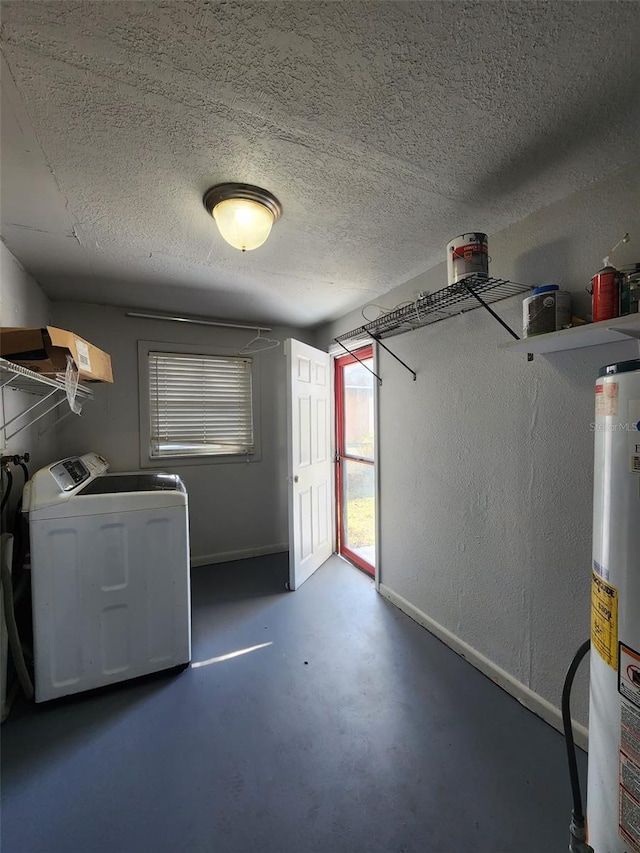 washroom with gas water heater, independent washer and dryer, and a textured ceiling