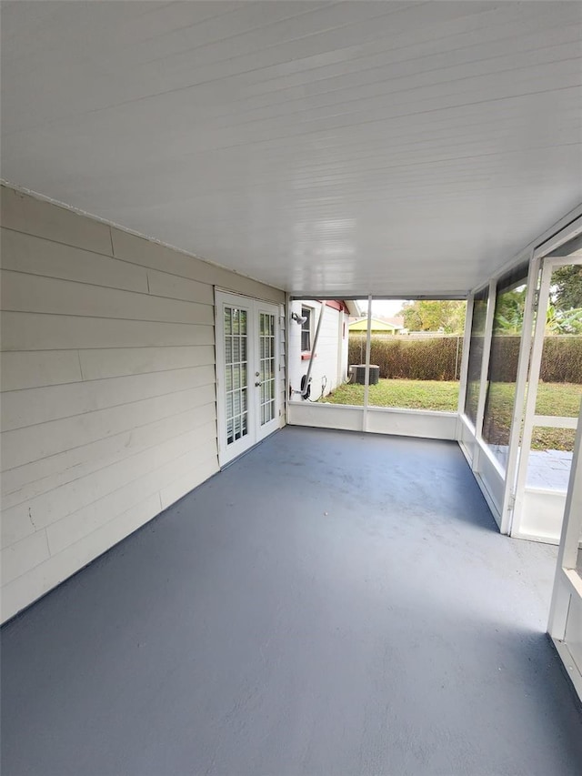 unfurnished sunroom featuring french doors