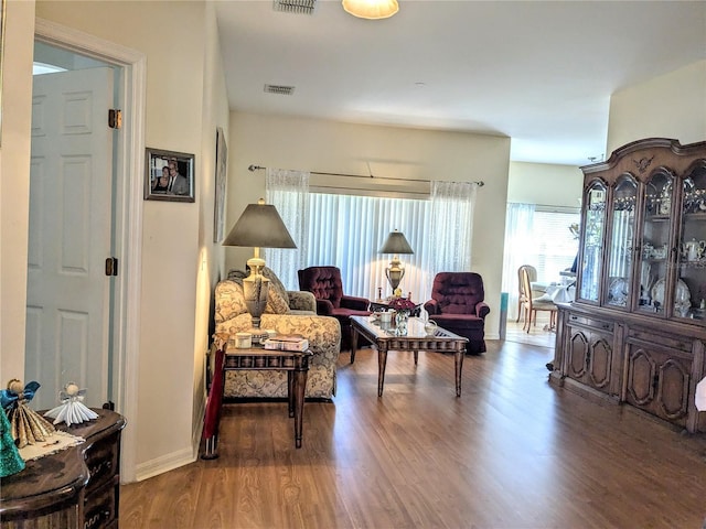 sitting room with wood-type flooring