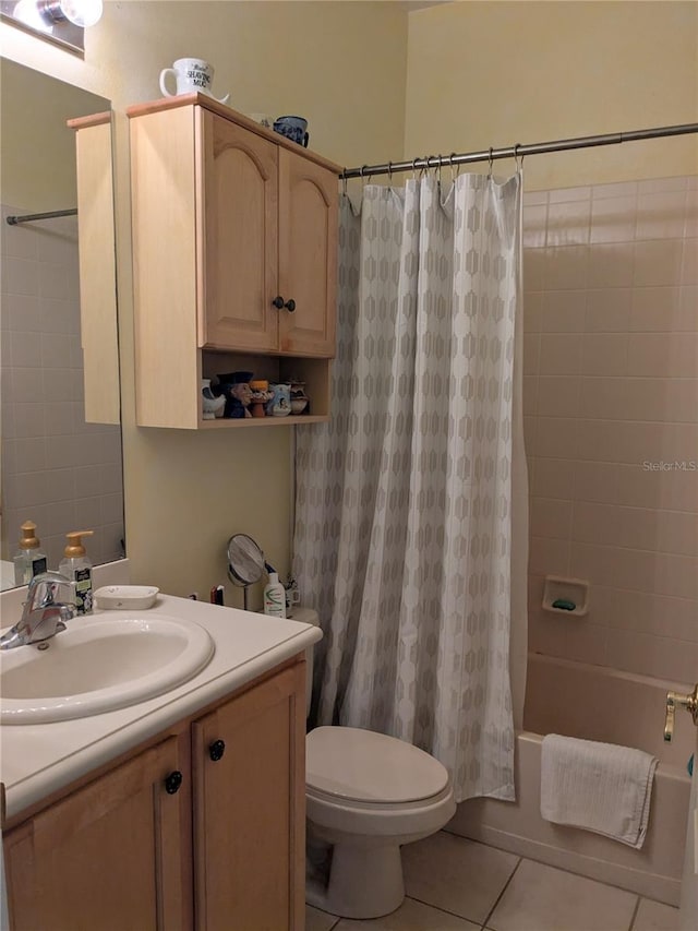 full bathroom with toilet, vanity, tile patterned floors, and shower / bath combo