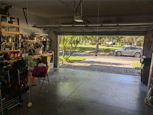 garage featuring a workshop area and a garage door opener