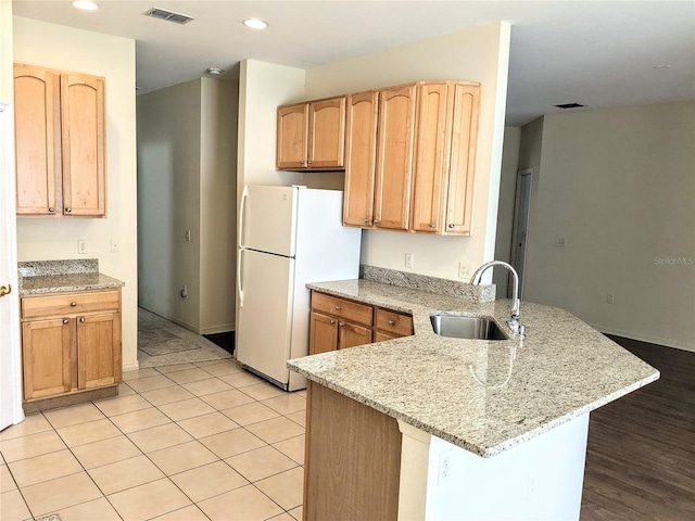 753 Largo Pass, Poinciana, FL 34759 - kitchen featuring a sink, freestanding refrigerator, a peninsula, recessed lighting, and visible vents