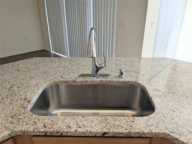 753 Largo Pass, Poinciana, FL 34759 - interior details featuring light stone counters and a sink