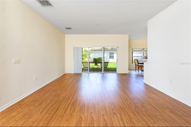 753 Largo Pass, Poinciana, FL 34759 - empty room with visible vents, baseboards, and light wood-type flooring