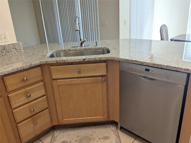 753 Largo Pass, Poinciana, FL 34759 - kitchen with a sink, light stone counters, stainless steel dishwasher, and light tile patterned flooring