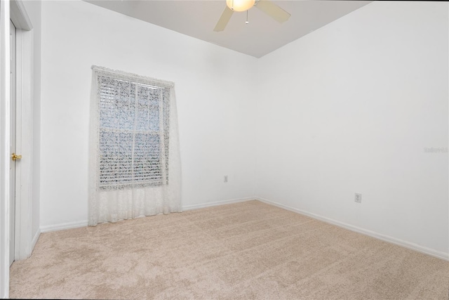 753 Largo Pass, Poinciana, FL 34759 - spare room with baseboards, ceiling fan, and carpet flooring
