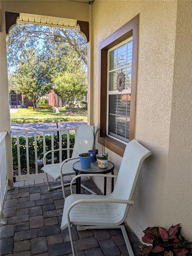 753 Largo Pass, Poinciana, FL 34759 - view of patio / terrace featuring covered porch
