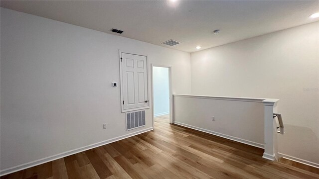 unfurnished room featuring wood-type flooring