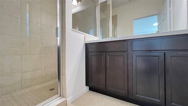 bathroom with tile patterned floors and walk in shower