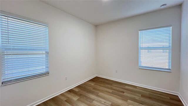 empty room featuring wood-type flooring