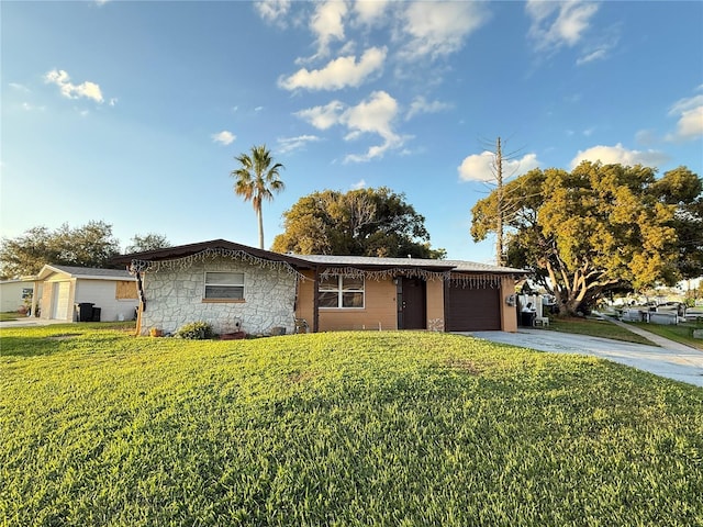 ranch-style house with a front yard and a garage