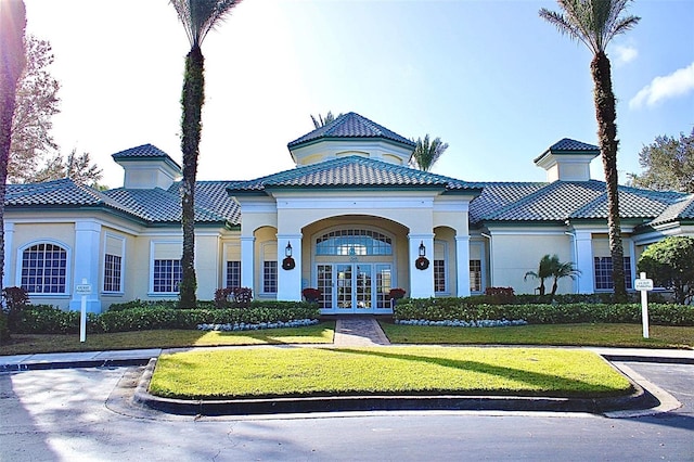 mediterranean / spanish house featuring french doors