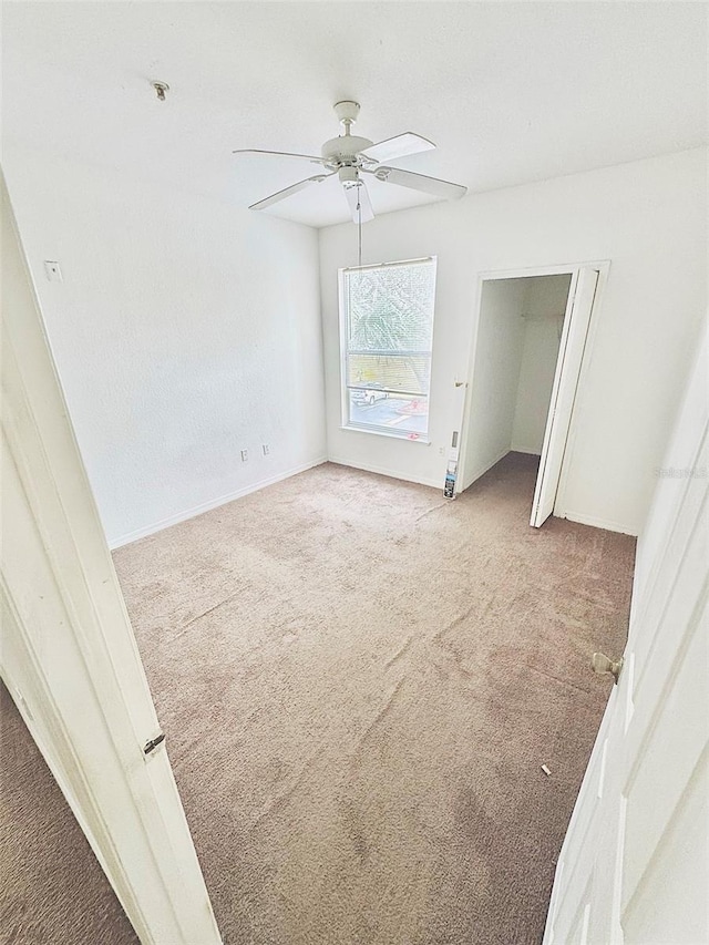 spare room with light colored carpet