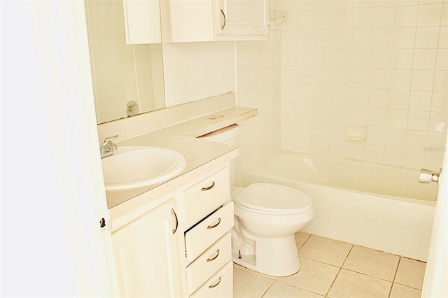 full bath with tile patterned floors, bathing tub / shower combination, toilet, and vanity