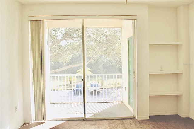 doorway featuring carpet