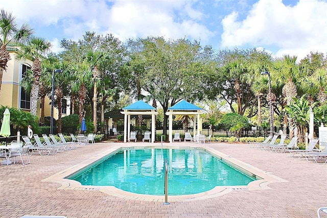 view of swimming pool featuring a gazebo and a patio