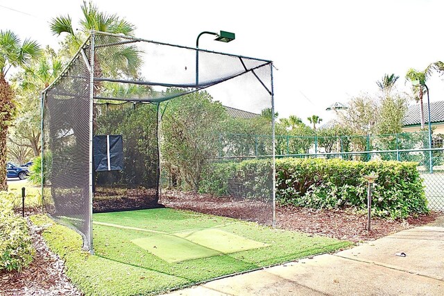 view of property's community featuring fence and a lawn