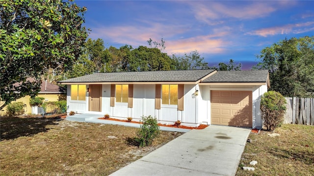 single story home with a porch and a garage